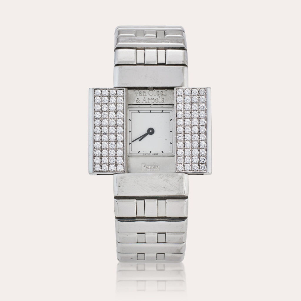 View full screen - View 1 of Lot 18. Reference 330976 Domino 39 | A white gold and diamond-set bracelet watch, Circa 2000.