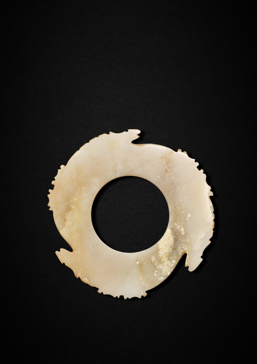 View full screen - View 1 of Lot 3604. A rare jade notched disc, Neolithic period - Shang dynasty | 新石器時代至商 玉牙璧.