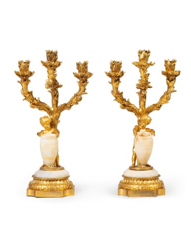 View full screen - View 1 of Lot 254. A pair of gilt-bronze and alabaster three-light candelabra, Napoleon III, circa 1860 | Paire de candélabres à trois lumières en bronze doré et albâtre d'époque Napoléon III, vers 1860.