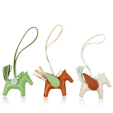View full screen - View 1 of Lot 719. Hermès Set of Three: A Touch Rodeo Charm and Two Rodeo Pegase Charms.
