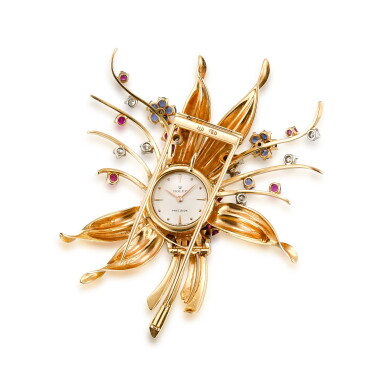 View full screen - View 1 of Lot 1112. ROLEX | A YELLOW GOLD, DIAMOND, RUBY AND SAPPHIRE-SET BROOCH WITH TIMEPIECE, CIRCA 1960.