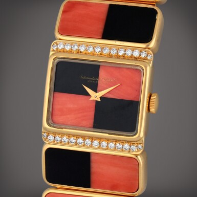 View full screen - View 1 of Lot 417. Reference 7152 | A coral, onyx and diamond-set bracelet watch with matching earrings | Circa 1970.