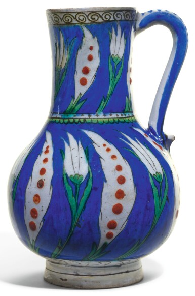 View full screen - View 1 of Lot 490. AN IZNIK BLUE GROUND POTTERY JUG WITH SAZ LEAVES AND TULIPS, TURKEY, CIRCA 1585.