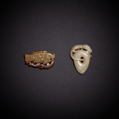 View full screen - View 1 of Lot 9477. A white jade 'chilong' pendant and a celadon jade 'fish' pendant, Ming dynasty | 明 白玉螭龍雞心珮及青玉仿古魚形珮 一組兩件.
