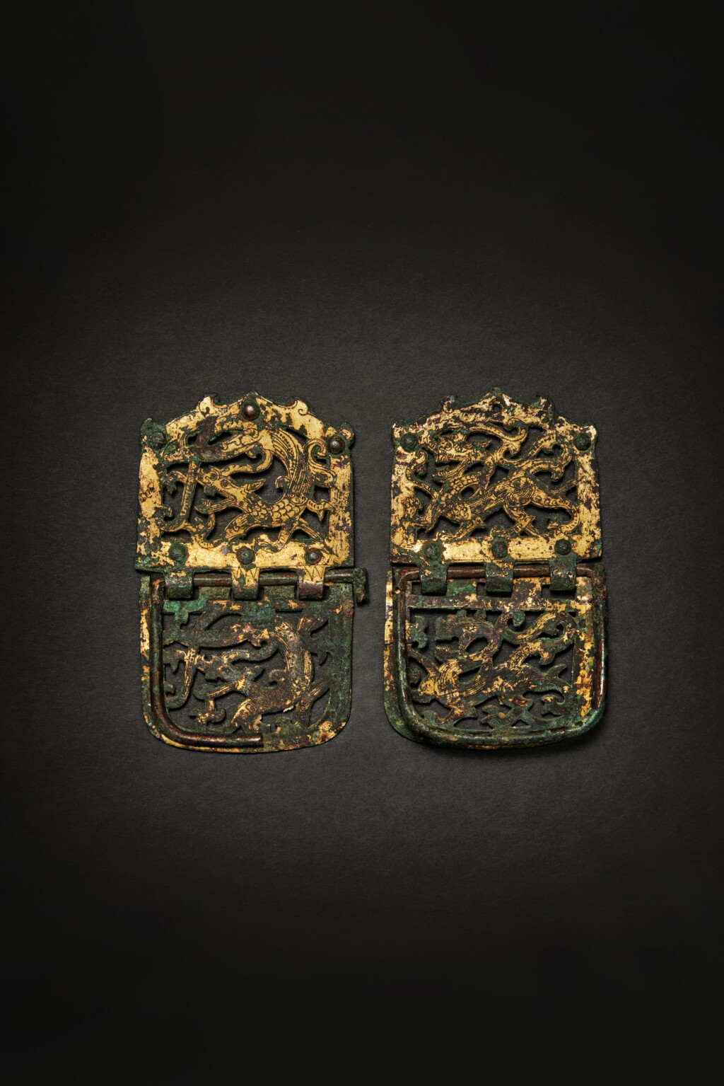 View full screen - View 1 of Lot 63. A pair of gilt-bronze openwork hinged belt plaques, Six dynasties.