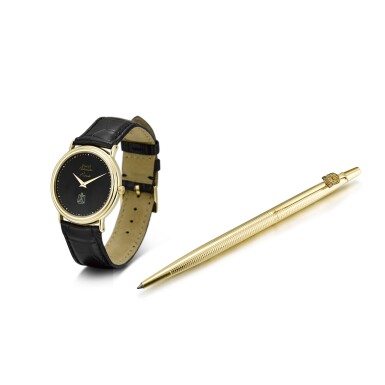 View full screen - View 1 of Lot 8229. PIAGET | REFERENCE 12332 A YELLOW GOLD WRISTWATCH WITH HAWK OF QURAYSH DIAL AND A GOLD PLATED BALL POINT PEN, CIRCA 1990 .