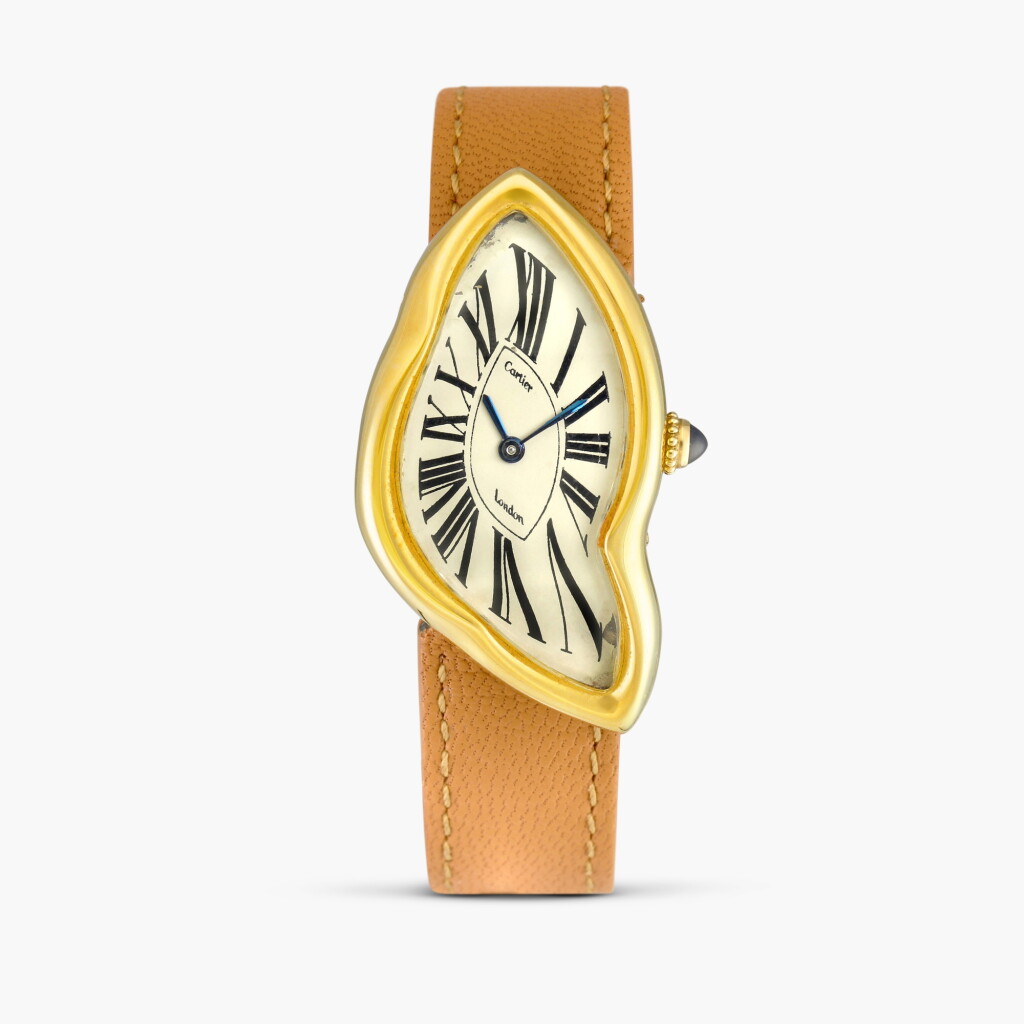 View full screen - View 1 of Lot 2361. Crash | A rare and iconic yellow gold distorted oval wristwatch, believed to be one of only three examples made in 1987, accompanied by its original gold deployant buckle, Circa 1987 .