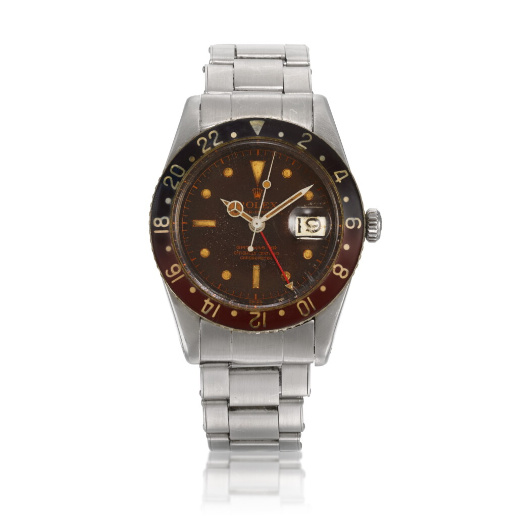 View full screen - View 1 of Lot 4. ‘Pussy Galore’ GMT-Master, Ref. 6542 Stainless steel dual time zone wristwatch with a tropical dial, date and bracelet Circa 1957.