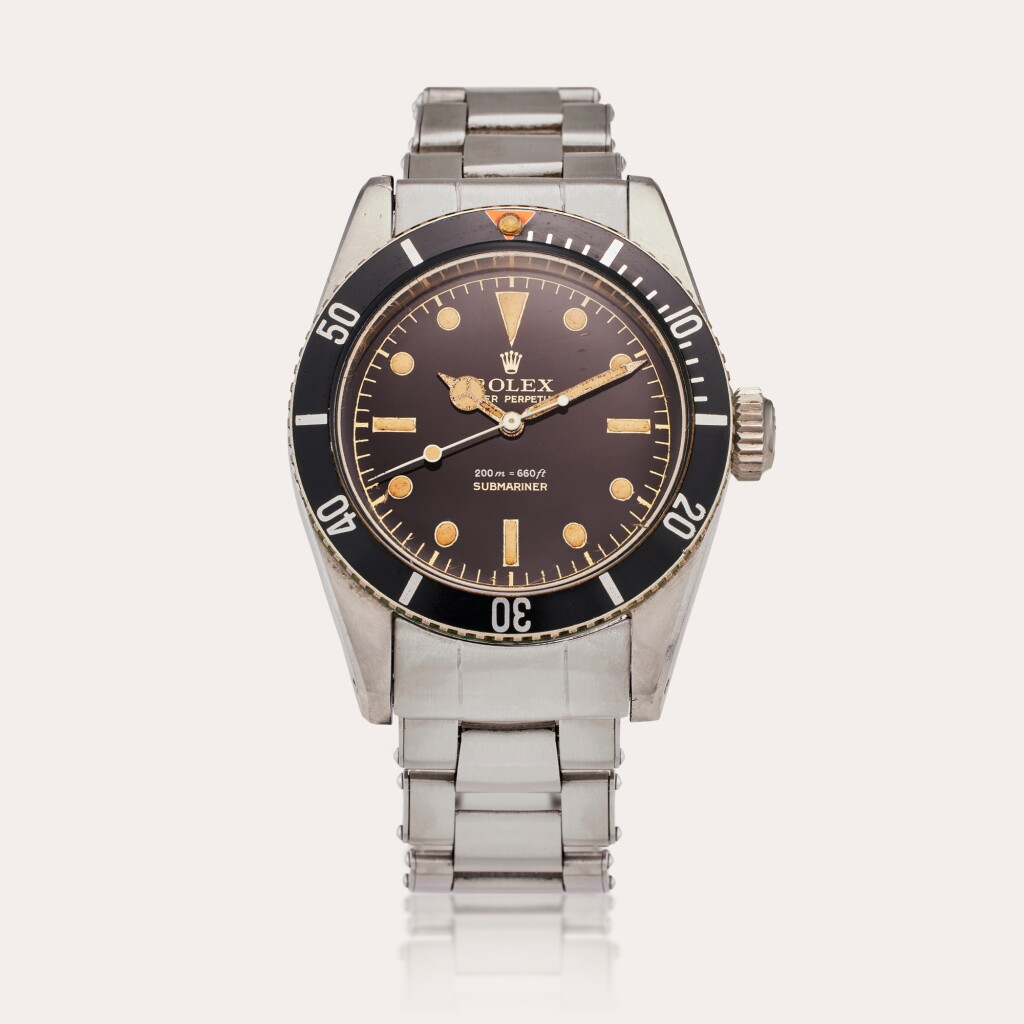 View full screen - View 1 of Lot 170. Reference 6538 Submariner ‘Big Crown James Bond’ | A stainless steel automatic wristwatch with gilt dial and bracelet, Circa 1959.