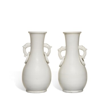 View full screen - View 1 of Lot 932. A pair of 'Dehua' handled vases, Qing dynasty, Kangxi period.