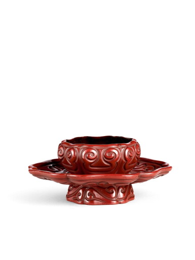 View full screen - View 1 of Lot 3847. A rare cinnabar 'tixi' lacquer lobed bowl stand, Yuan - Ming dynasty | 元至明 朱面剔犀如意雲紋葵式盞托.