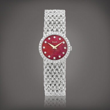 View full screen - View 1 of Lot 975. Reference 9706 N 39 | A white gold and diamond-set bracelet watch with rubellite dial, Circa 1970 | 伯爵 | 型號9706 N 39 | 白金鑲鑽石鏈帶腕錶,備紅碧璽錶盤,約1970年製.
