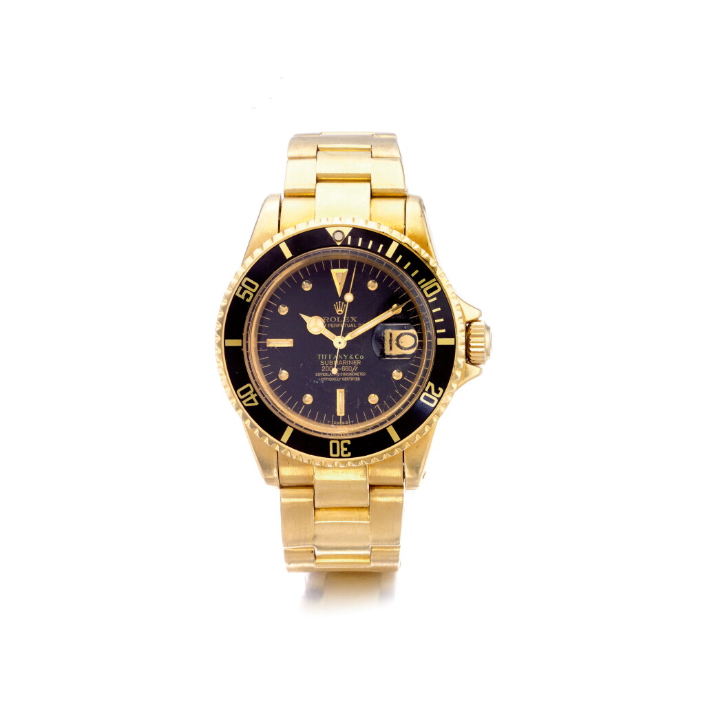 View full screen - View 1 of Lot 878. ROLEX | REF 1680 SUBMARINER, RETAILED BY TIFFANY & CO.: A YELLOW GOLD AUTOMATIC CENTER SECONDS WRISTWATCH WITH DATE AND BRACELET, CIRCA 1969 | 勞力士 | 零售商為蒂芙尼:1680型號「SUBMARINER」黃金自動上鏈鍊帶腕錶備日期顯示,年份約1969.