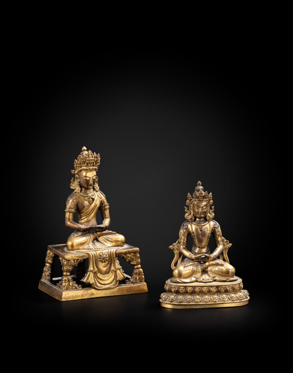 View full screen - View 1 of Lot 16. Two gilt-bronze figures of Amitayus Qing dynasty, Qianlong period | 清乾隆 鎏金銅無量壽佛坐像兩尊.