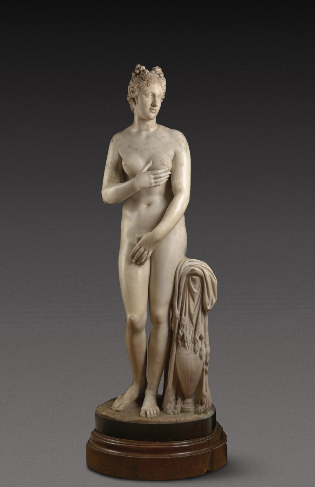 View full screen - View 1 of Lot 70. A Marble Figure of the Capitoline Aphrodite, Roman Imperial, 1st/2nd Century A.D., with 18th Century Restorations.