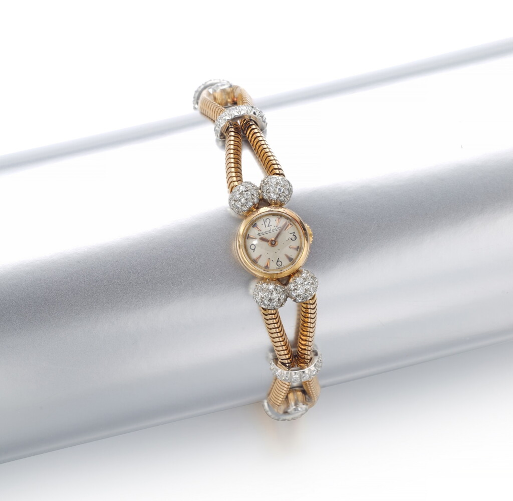 View full screen - View 1 of Lot 31. LADY'S GOLD AND DIAMOND WRISTWATCH | JAEGER LECOULTRE.