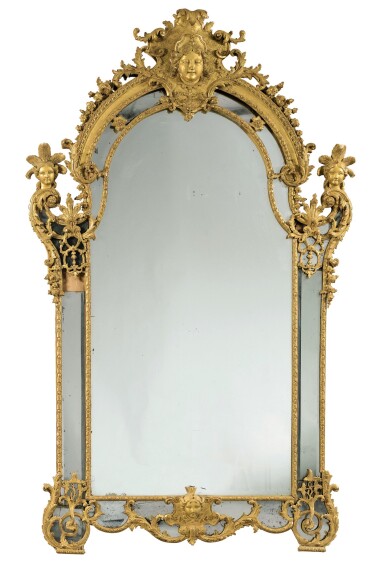 View full screen - View 1 of Lot 114. A LOUIS XV LARGE CARVED GILTWOOD MIRROR, CIRCA 1730 | GRAND MIROIR À PARCLOSES EN BOIS SCULPTÉ ET DORÉ D'ÉPOQUE LOUIS XV, VERS 1730.
