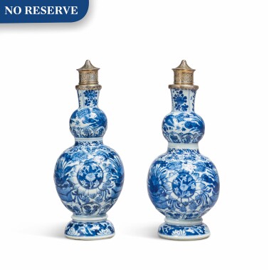 View full screen - View 1 of Lot 26. TWO CHINESE BLUE AND WHITE PORCELAIN DOUBLE GOURD VASES, CIRCA 1700.