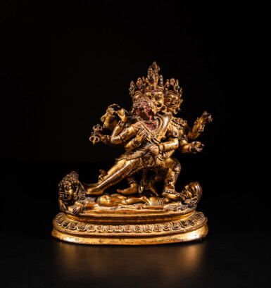 View full screen - View 1 of Lot 6. A rare inscribed gilt-bronze figure of Mahottara Heruka, Tibet, 14th century | 十四世紀 藏傳銅鎏金赫魯嘎立像.