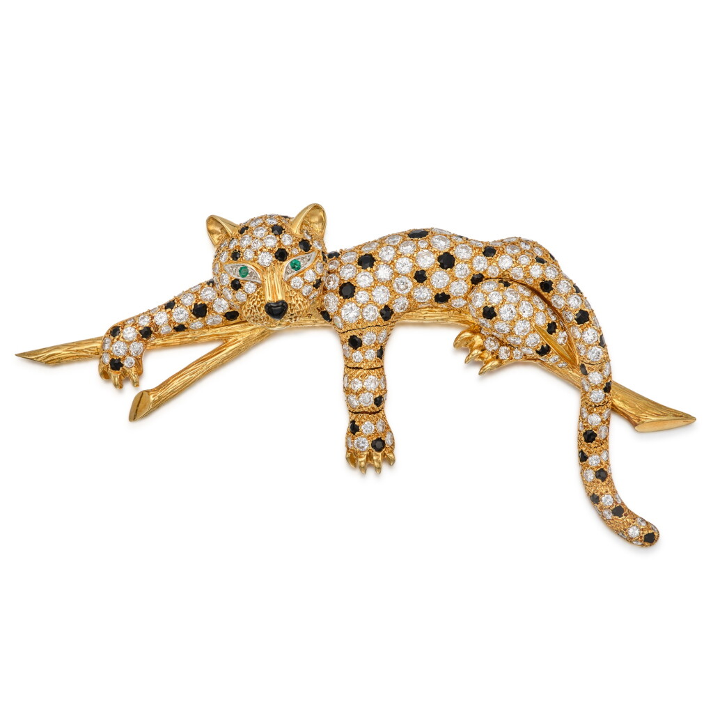 View full screen - View 1 of Lot 191. A Diamond, Onyx and Emerald Clip-Brooch.