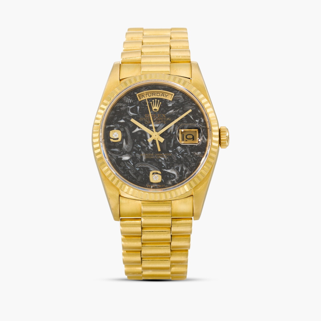 View full screen - View 1 of Lot 3. Day-Date, Reference 18238 | A yellow gold ammonite dial and diamond-set wristwatch with day, date and bracelet | Circa 2002.