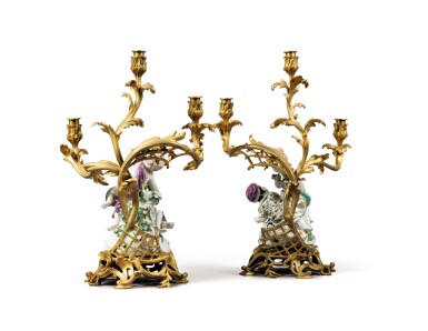 View full screen - View 1 of Lot 376. A pair of gilt-bronze and figural porcelain three-light candelabra by Henri Vian, Paris.