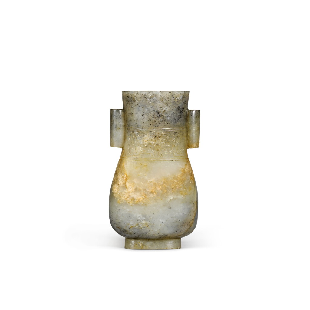 View full screen - View 1 of Lot 27. A motted celadon and grey jade baluster vase with tubular handles Yuan/Ming dynasty | 元/明 灰青玉貫耳瓶.