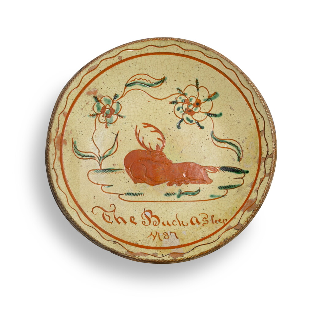 View full screen - View 1 of Lot 165. Sgraffito-Decorated Glazed Red Earthenware 'The Buck Asleep' Plate, attributed to David Spinner (1758–1811), Bucks County, Pennsylvania, Dated 1787.