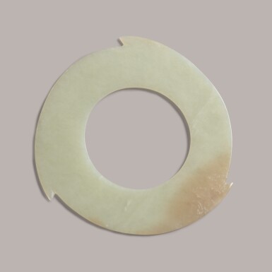 View full screen - View 1 of Lot 383. a pale celadon jade notched disc, xuanji, Late Neolithic period/Shang dynasty | 新石器時代/商 玉璇璣.