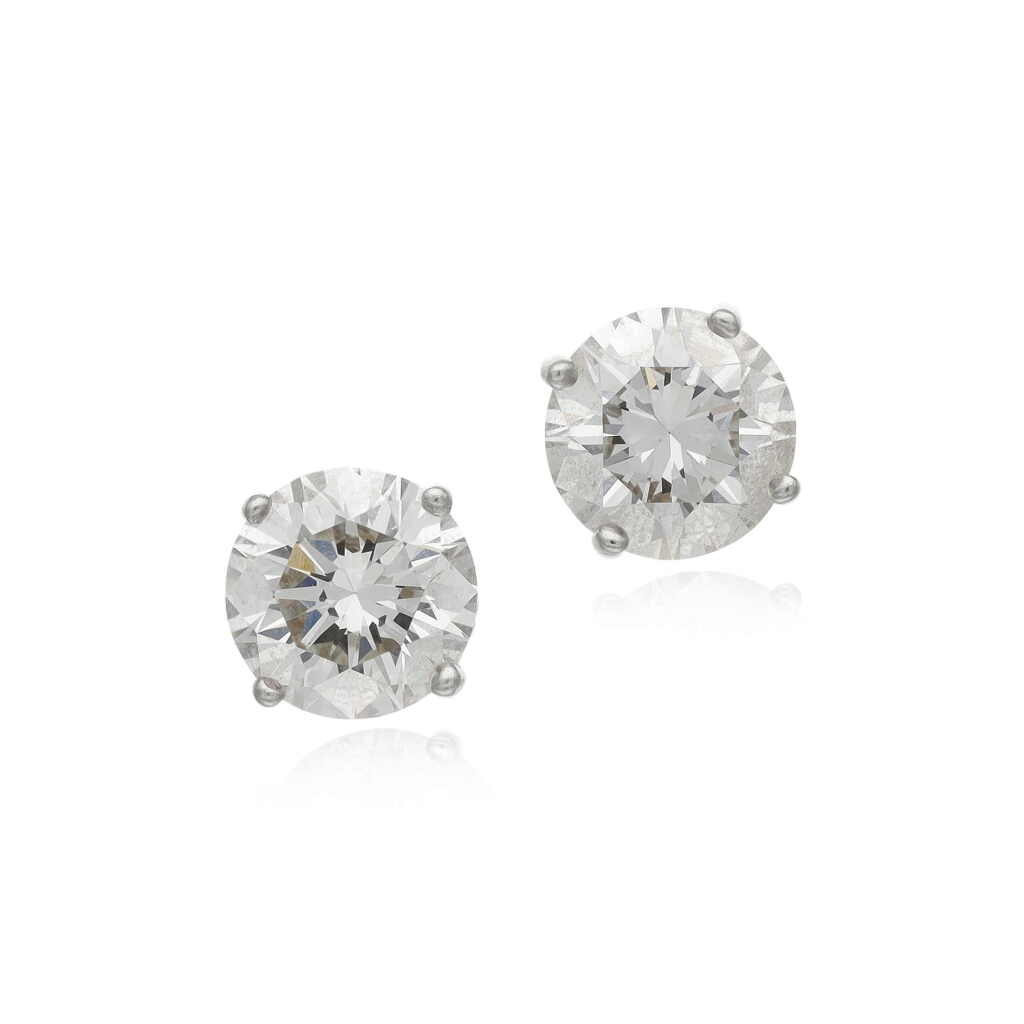 View full screen - View 1 of Lot 128. Pair of diamond ear studs.