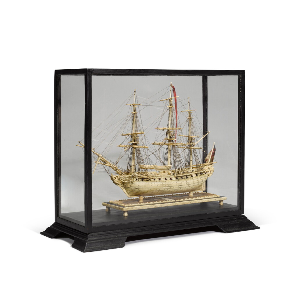 View full screen - View 1 of Lot 81. A Napoleonic Prisoner-of-War work carved bone ship model, early 19th century.