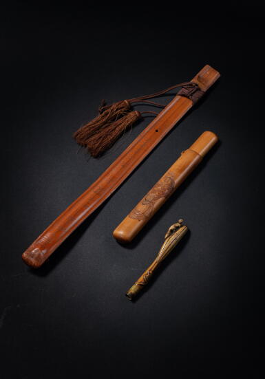 View full screen - View 1 of Lot 316. A carved 'Okame' pipe case, an inscribed bamboo backscratcher and a walrus ivory netsuke, Japan, Edo period.