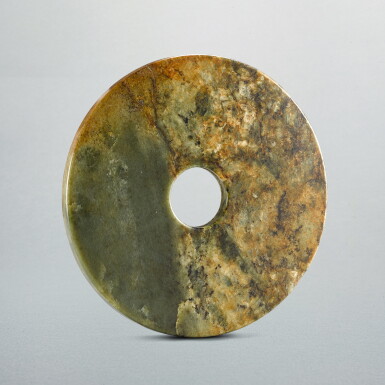 View full screen - View 1 of Lot 719. A celadon jade disc, bi, Neolithic period | 新石器時代 青玉素面璧.