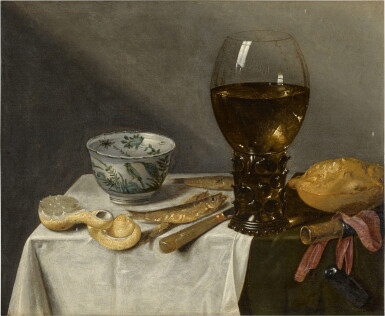 View full screen - View 1 of Lot 126. Still life with a roemer, porcelain bowl, fish and peeled lemon on a table draped with a white cloth.