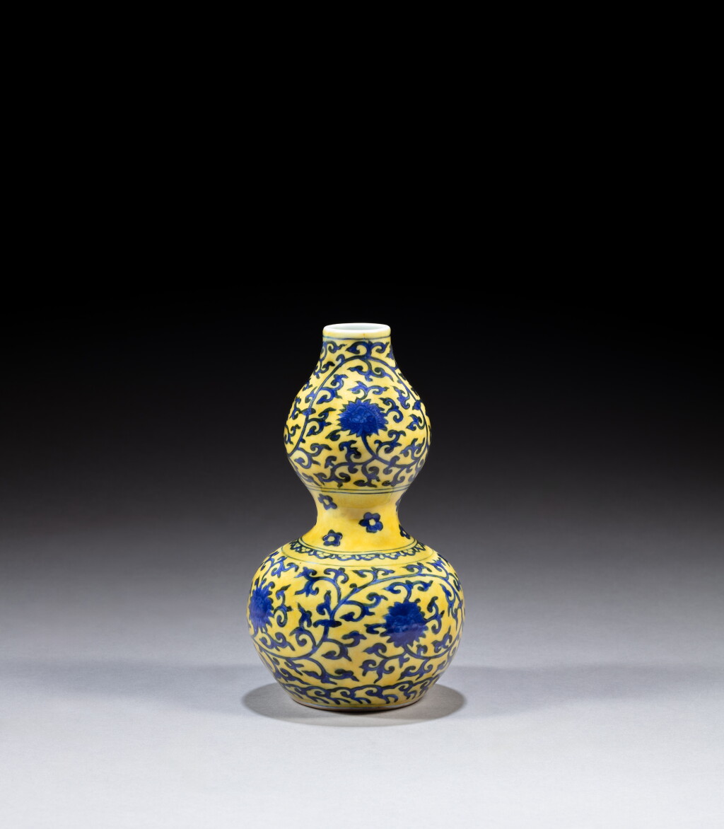 View full screen - View 1 of Lot 133. A yellow-ground underglaze-blue 'lotus' double-gourd vase, Mark and period of Jiajing | 明嘉靖 黃地青花纏枝蓮紋葫蘆瓶 《大明嘉靖年製》款.
