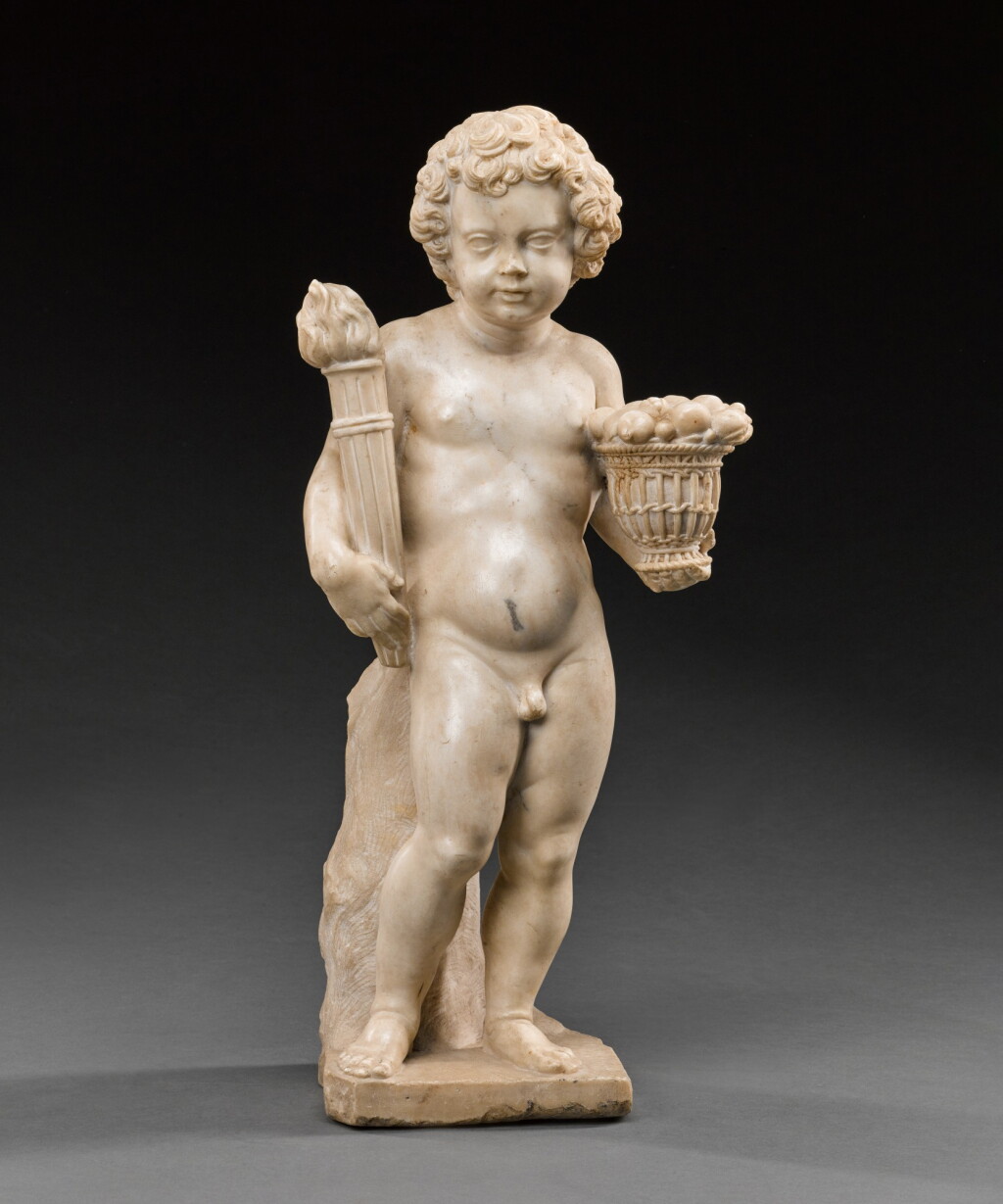 View full screen - View 1 of Lot 56. Italian, early 17th century | After the Antique | Putto holding a torch and a basket.