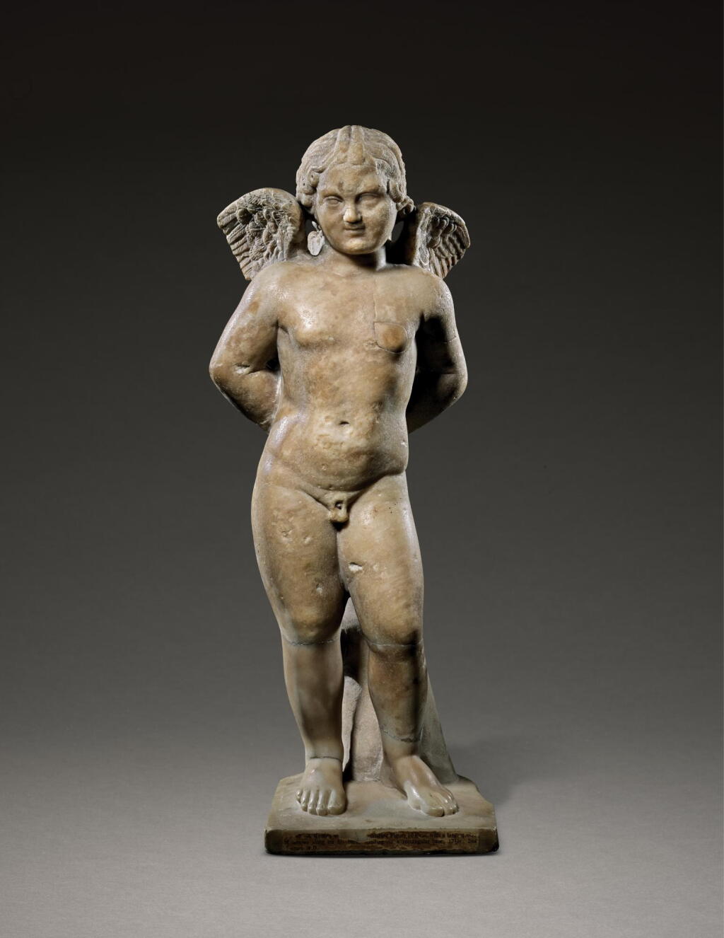 View full screen - View 1 of Lot 223. A ROMAN MARBLE FIGURE OF EROS BOUND, CIRCA 2ND CENTURY A.D..