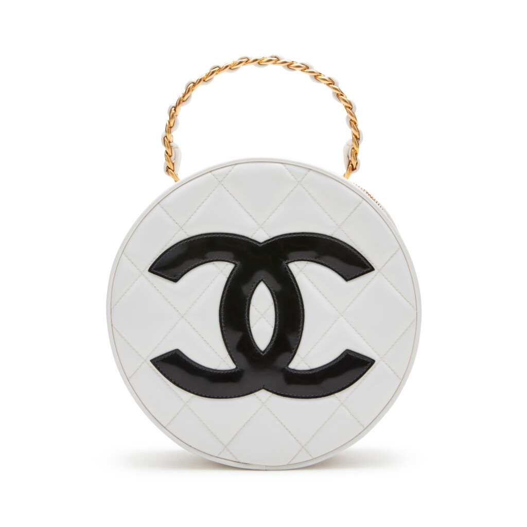View full screen - View 1 of Lot 148. Black and White Patent Leather Round CC Vanity Bag Gold Hardware, 1995.