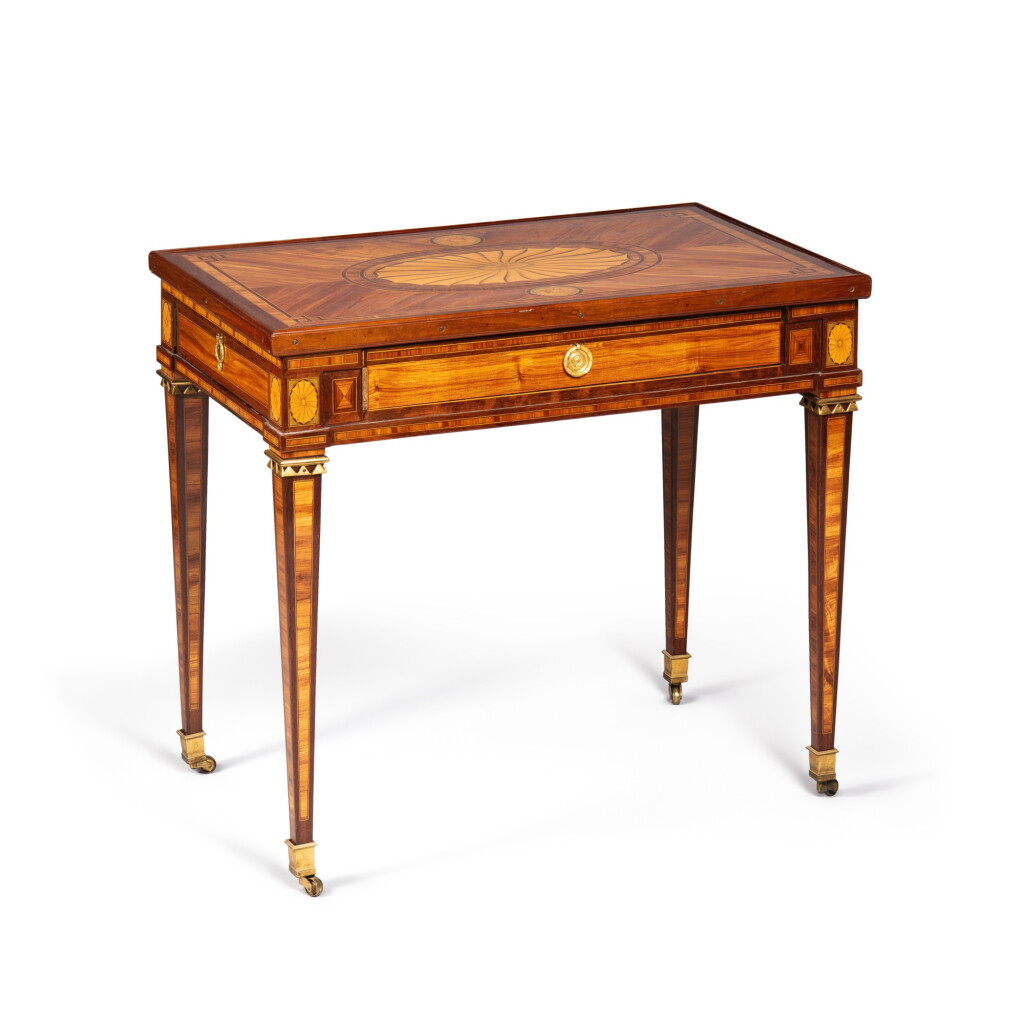 View full screen - View 1 of Lot 3. A Louis XVI gilt-bronze mounted tulipwood, amaranth, tinted holly, maple, ivory marquetry table à jeux, circa 1780 | Table à jeux en marqueterie de bois de rose, amarante, houx teinté, érable, ivoire et bronze doré d'époque Louis XVI, vers 1780.