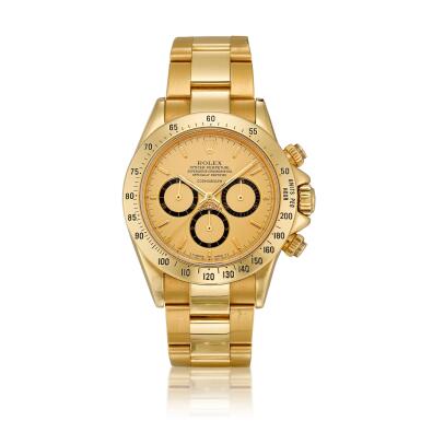 View full screen - View 1 of Lot 2069. Cosmograph Daytona, Reference 16528 | A yellow gold chronograph wristwatch with suspended logo and bracelet, Circa 1988, Formerly in the Collection of Eric Clapton, CBE | 勞力士 | Cosmograph Daytona 型號16528 | 黃金計時鏈帶腕錶,約1988年製,原為 Eric Clapton, CBE 收藏 .