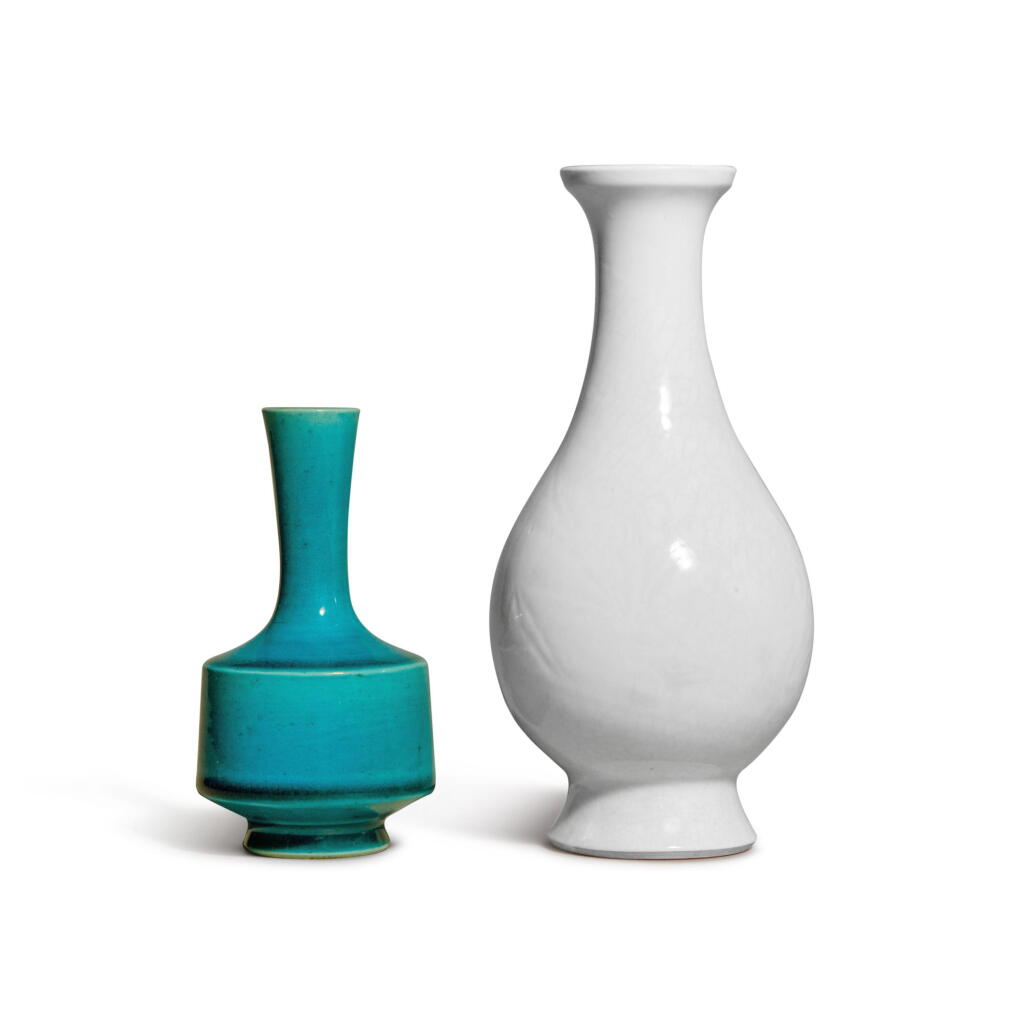 View full screen - View 1 of Lot 920. A carved white-glazed soft-paste 'peony' vase and a small turquoise-glazed bottle vase, Qing dynasty | 清 白釉暗刻牡丹紋瓶及孔雀藍釉小長頸瓶.