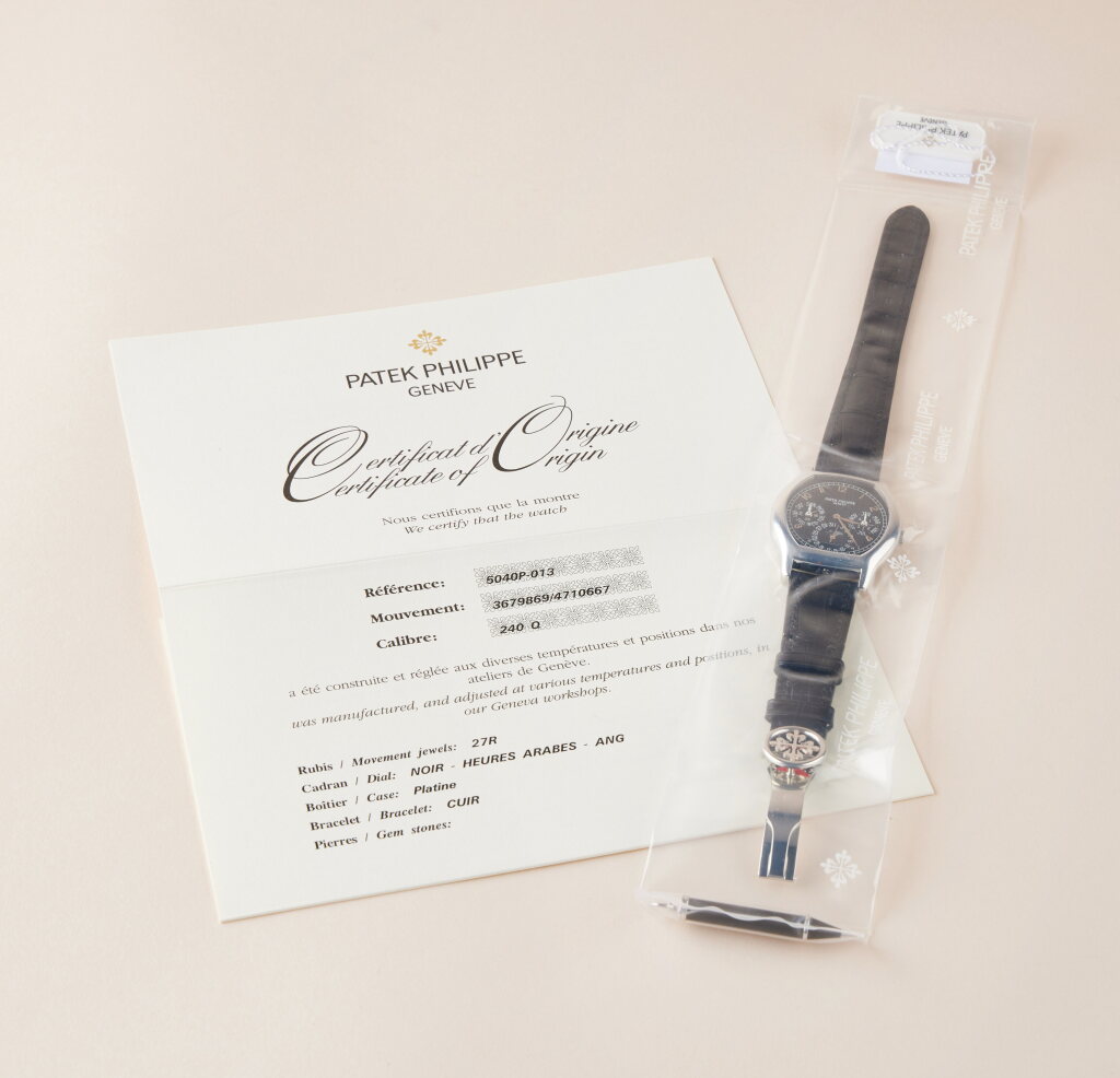 View full screen - View 1 of Lot 2353. Reference 5040 | A platinum perpetual calendar wristwatch with moon phases, 24 hour and leap year indication, in single factory seal, Circa 2009.