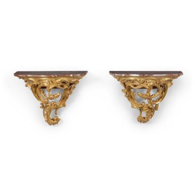 View full screen - View 1 of Lot 101. A Pair of George II Style Carved and Giltwood Wall Consoles, 19th/20th Century.