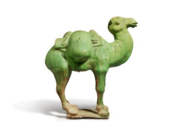View full screen - View 1 of Lot 716. A green-glazed pottery figure of a Bactrian camel, Tang dynasty | 唐 綠釉駱駝.