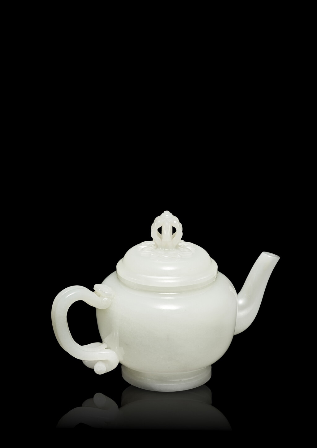 View full screen - View 1 of Lot 3630. An exceptional and finely carved white jade teapot and cover, Qing dynasty, Qianlong period | 清乾隆 白玉金剛杵鈕萬壽如意耳茶壺.