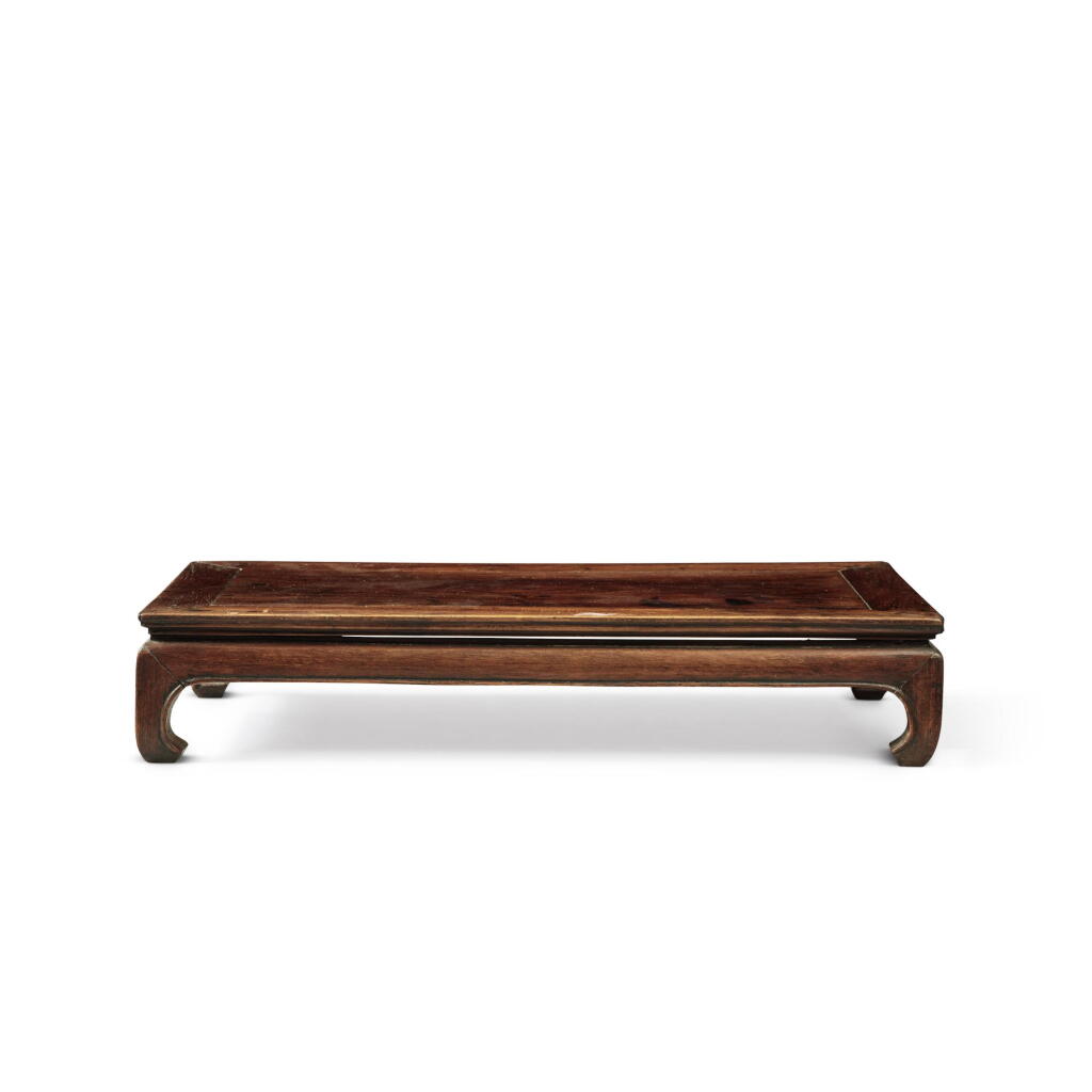 View full screen - View 1 of Lot 732. A small 'huanghuali' rectangular display stand, Qing dynasty, 18th century | 清十八世紀 黃花梨有束腰長方小几.