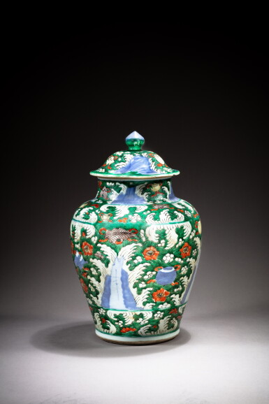 View full screen - View 1 of Lot 189. A blue and white green and iron red enameled 'churning waves' jar and cover, Qing dynasty, 17th century | 清十七世紀 青花波浪紋蓋罐.