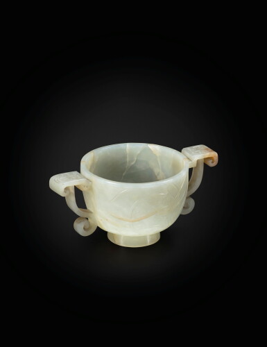 View full screen - View 1 of Lot 153. A celadon jade archaistic handled cup 17th-18th century | 十七至十八世紀 青白玉蘭花紋雙耳盃.