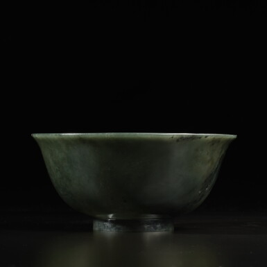 View full screen - View 1 of Lot 845. A spinach-green jade bowl, Seal mark and period of Qianlong | 清乾隆 碧玉盌 《大清乾隆年製》.