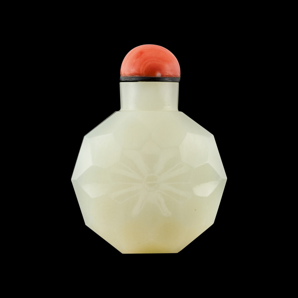 View full screen - View 1 of Lot 1004. A facetted white jade octagonal snuff bottle Qing dynasty, 18th century | 清十八世紀 白玉磨花八方鼻煙壺.